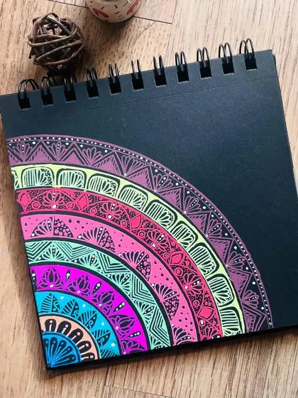 A semi-circular mandala showcasing a rainbow of colors and intricate patterns. This design is perfect for adding a splash of color to a smaller space.