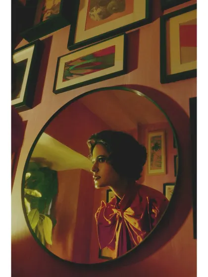 The use of mirrors is a recurring motif in "Love in Future Past," symbolizing self-reflection and the fractured way we see ourselves through the lens of past love and future hopes.