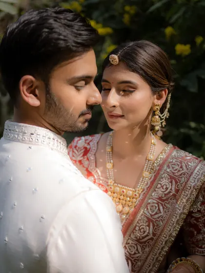 An intimate couple moment. Yashvi's makeup looks flawless and natural, perfect for capturing these precious memories.