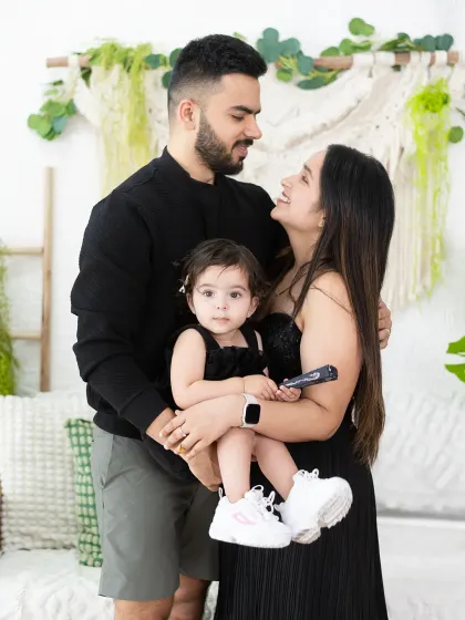 A candid family headshot session in our studio. We capture the loving and playful interactions that show the real personality of your family.