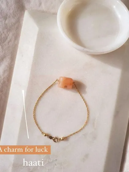 The 'háati' Peach Moonstone elephant bracelet, a charm for luck.