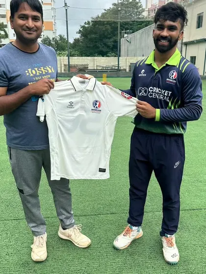 A senior player and coach together at the jersey ceremony. This shows the strong bond and mutual respect within our academy.