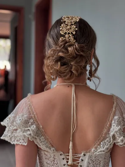 A full view of the romantic messy updo, ideal for an elegant evening look.