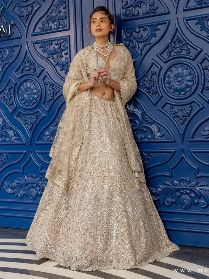 A golden dream woven in brilliance. This radiant lehenga from the 'Ruvaah' collection is crafted with intricate geometric embroidery and glimmering sequins.
