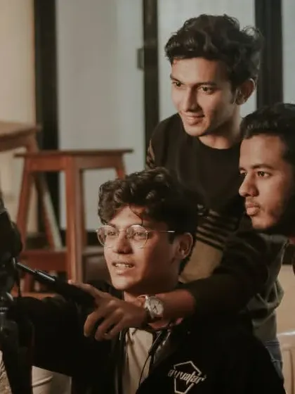 Collaboration is everything. Here's a shot of me and my team reviewing footage together on set to make sure we're all aligned with the creative vision.