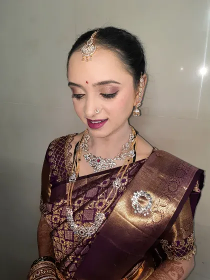 A soft and elegant makeover for an after-wedding ritual. I used subtle eyeshadow and a mauve lip to complement her beautiful diamond jewelry and rich purple silk saree.