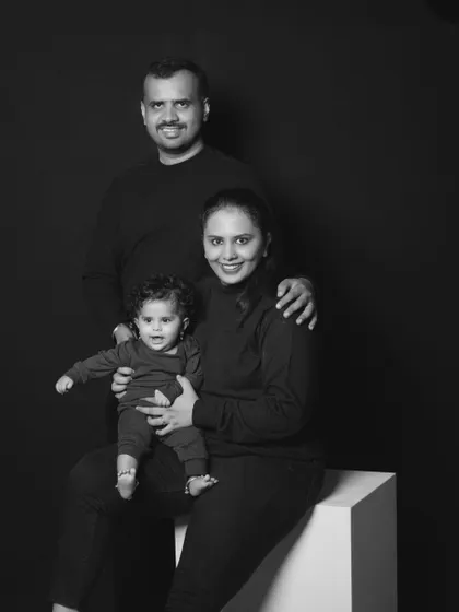 A beautiful black and white family portrait, capturing the warmth and love of a family of three.