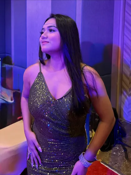 A candid shot in the shimmery olive dress. This look is perfect for a cocktail party or a fun corporate social.