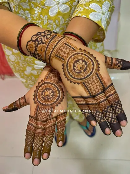 A fancy backhand design with a central lotus mandala and detailed finger work.