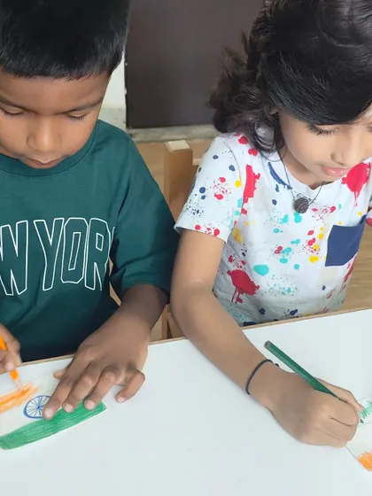 Children coloring the Indian flag in preparation for Independence Day. We believe celebrations should be meaningful, helping children understand the 'why' behind what we celebrate.
