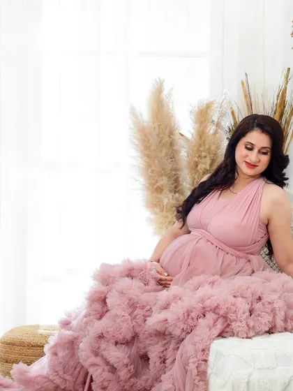 A variety of poses in a beautiful ruffled pink gown, showing its versatility for creating soft, romantic, and glamorous solo maternity portraits.