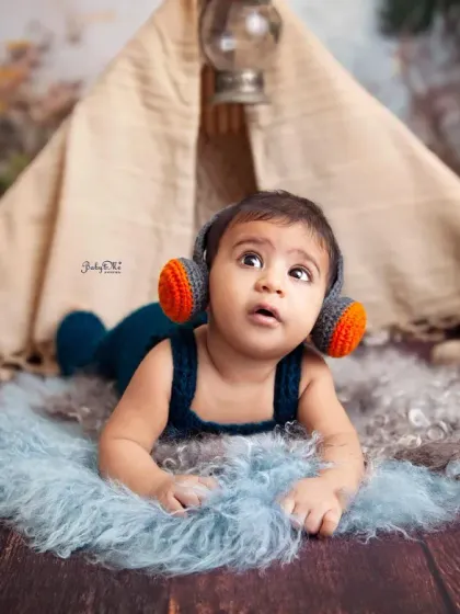 This little rockstar is listening to some tunes in our boho teepee setup. I love combining different themes to create a unique and personalized session for your baby.