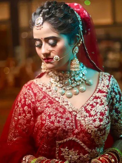 A close-up of my bride Juhi's eye makeup. The shimmery gold and black eyeshadow create a dramatic effect, perfect for a glamorous bridal look.