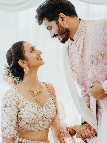 A classic, romantic portrait of the couple looking at each other with love and admiration.