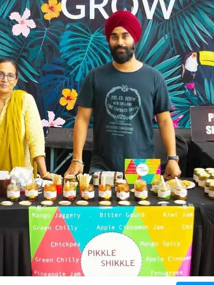 Posing at our stall with my son. This business is a family affair, and their support means the world to me.