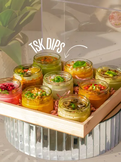 A tray of our colourful dips basking in the summer sun. These fresh, vibrant flavours are the perfect refreshment for a warm day.