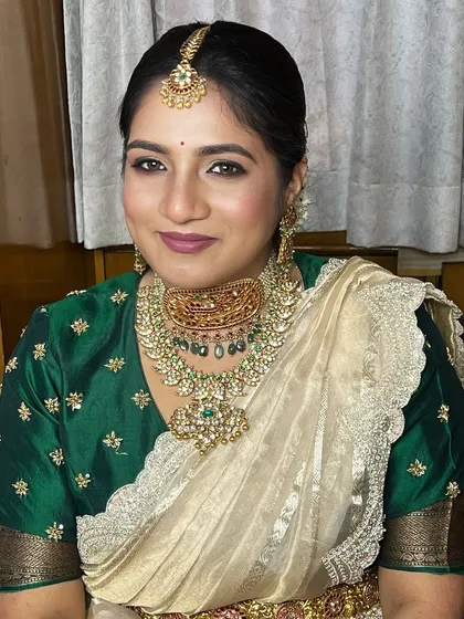 A smiling portrait of the client, her confidence and grace shining through.