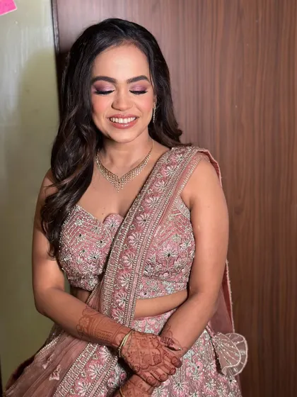 Another lovely portrait with her eyes closed, highlighting the blended eyeshadow and the overall softness of the makeup.