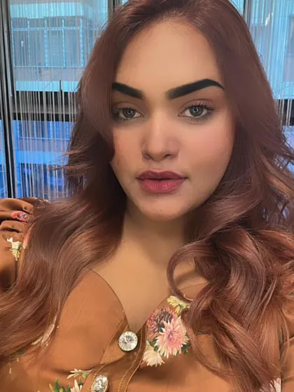 A full view of the stunning rosy-brown color, achieved after correcting a patchy box dye job.