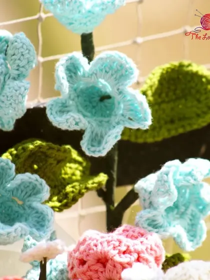 A detailed shot of the light blue flowers in one of my custom bouquets, showing the delicate stitch work.