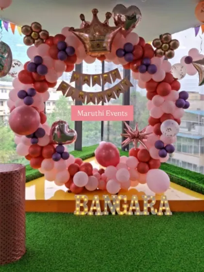 A royal-themed circular balloon arch in red, pink, and purple. The crown balloon on top makes it perfect for celebrating your little prince or princess.