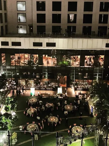 A higher-angle shot of the outdoor Diwali event, showing the full scale of the celebration within the hotel's central courtyard. This demonstrates our experience with large hotel venues.