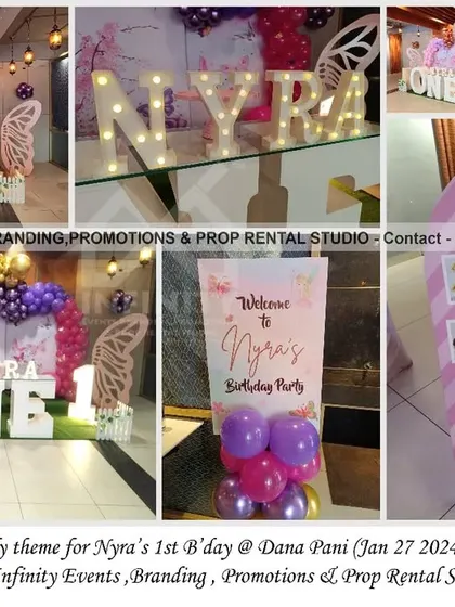 A beautiful butterfly theme for a first birthday at Dana Pani. The setup features a semi-arch backdrop with a balloon garland, a large "ONE" table, and a custom milestone board, creating a dreamy and personalized party.
