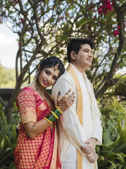 A sweet and relaxed portrait. The bride leans on her groom's shoulder, a simple pose that feels incredibly warm and genuine. Capturing these moments is what Weddings by Heart is all about.