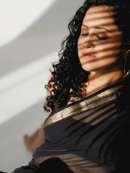 A duplicate of the artistic shadow play image, highlighting the subtle makeup.