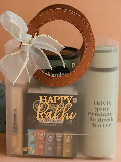 Our "best brother" hamper shown in its stylish transparent packaging with a leather-handle bag, making it easy to gift.