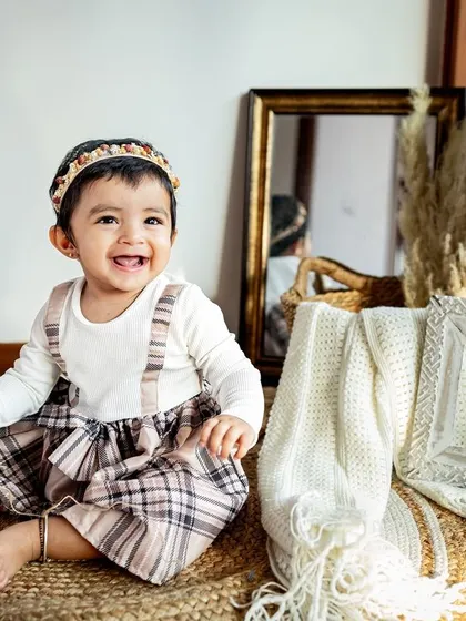 That sweet, knowing smile from a toddler is just heart-melting. These close-up portraits really let their adorable personality shine through.