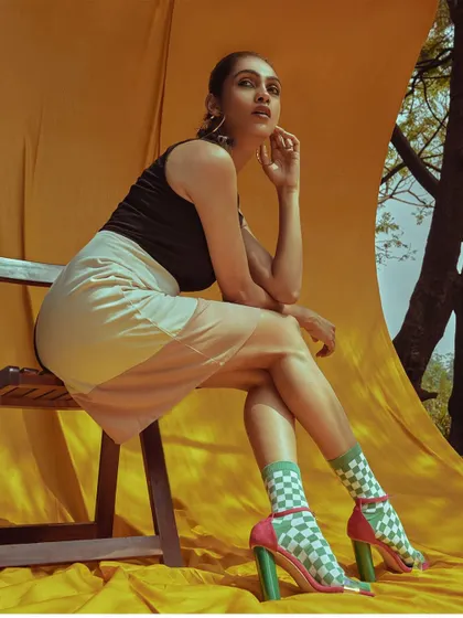 An editorial look for Off Town Magazine from the 'ELINOR' series. I paired a modern color-block dress with playful checkered socks and heels, set against a bold yellow backdrop to create a graphic, high-impact fashion statement.