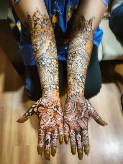 This is the beautiful result after the henna paste has been removed. You can see the rich, dark stain of a traditional design featuring palaces and intricate fillers.