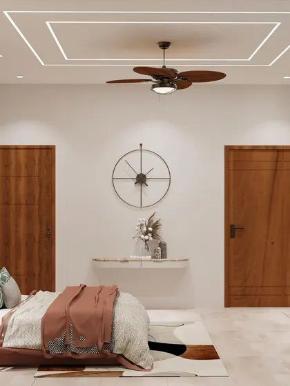 The opposite wall features a simple console table and a large clock, maintaining a clean and uncluttered feel.