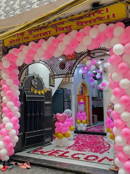 Another view of the impressive pink and white balloon arch for the 'Welcome Baby' celebration.