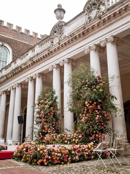 Different angles of the stunning floral mandap and ceremony setup at Hampton Court Palace, showing the scale and detail of the design.