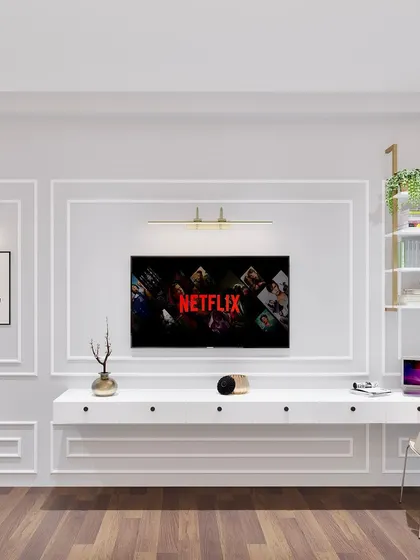 A sophisticated TV unit and study desk combination, perfect for a master bedroom. The design features classic wall molding for an elegant touch.
