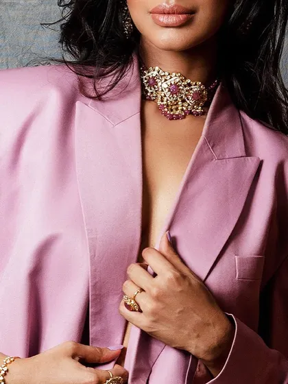 A cropped shot focusing on the beautiful choker and the sleek lines of the blazer. This emphasizes the luxury aspect of the styling.