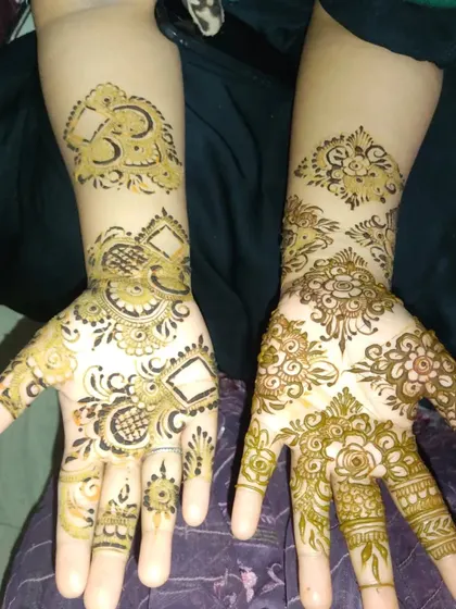 A work in progress, showing two different modern designs side-by-side. One features Dubai-style geometric shapes, while the other is a softer floral pattern.