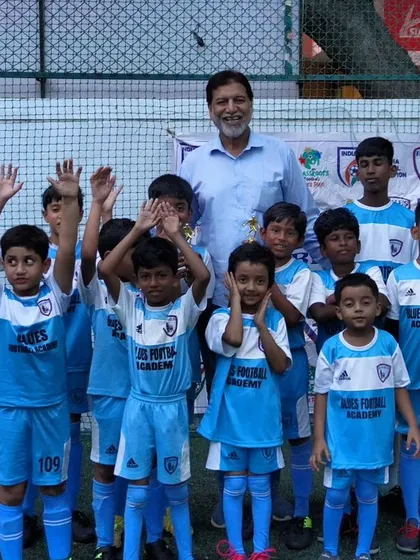 Happy Children's Day! Our young players wave and smile, representing the boundless energy and future of our academy.