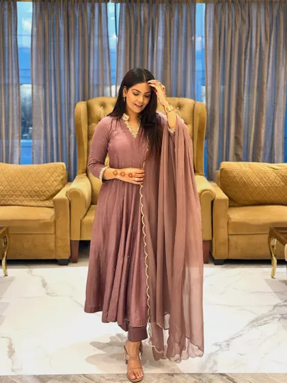 A closer look at the Anarkali, showing the subtle detailing on the sleeves and the simple, elegant drape of the dupatta.