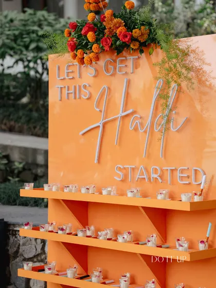 'Let's Get This Haldi Started.' A fun, interactive station with shots of turmeric milk or other welcome drinks, designed to get the party going.