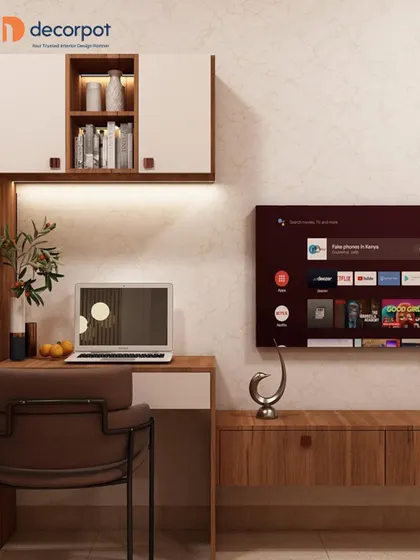 This design shows a multi-functional wall unit that combines a TV console with a compact study desk. The warm wood tones and integrated lighting create a cozy and efficient workspace.