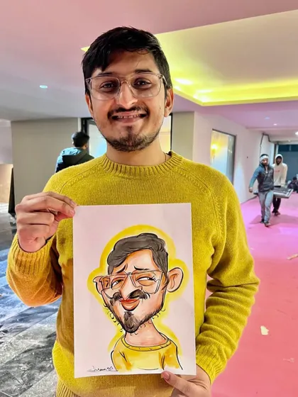 A happy client holding his colorful caricature. These portraits make for a unique and joyful memory that can be framed and cherished.