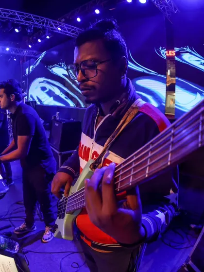 A close-up of the bassist from Mithoon's band, showing the high-caliber musicians we work with.