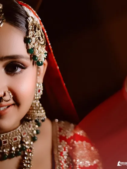 A striking half-face portrait of bride Winnie, drawing attention to her expressive eyes and intricate bridal jewelry.