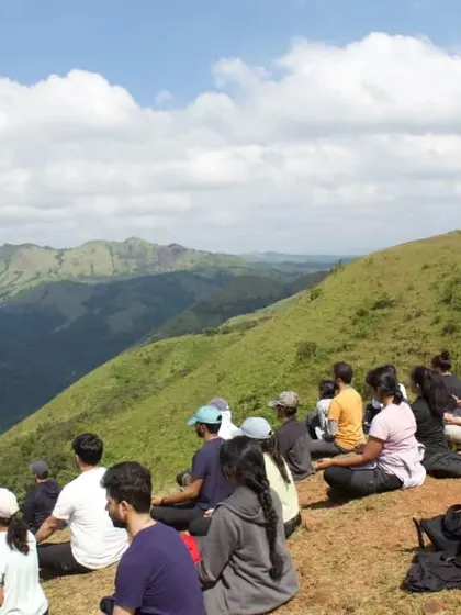 A beautiful moment from our Silent Trek to Etthina Bhuja in the Western Ghats. Participants are seated in meditation, absorbing the serene energy of the mountains.