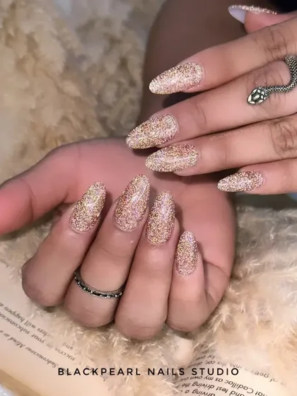 Another view of the flash glitter nails, showing how they catch the light to create a brilliant, diamond-like effect.