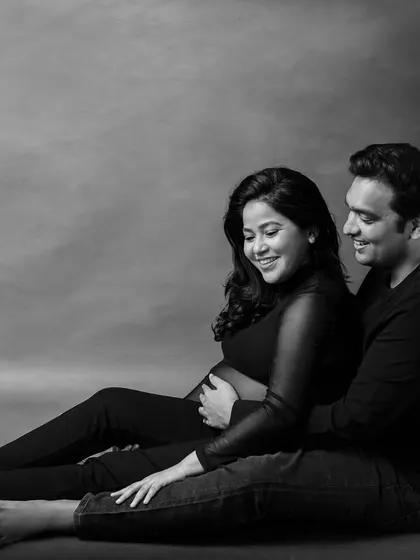 The same intimate couple's pose, rendered in timeless black and white to emphasize their connection.