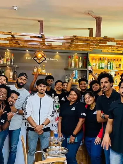 A group of students and instructors celebrating together after a practical class in Bangalore.